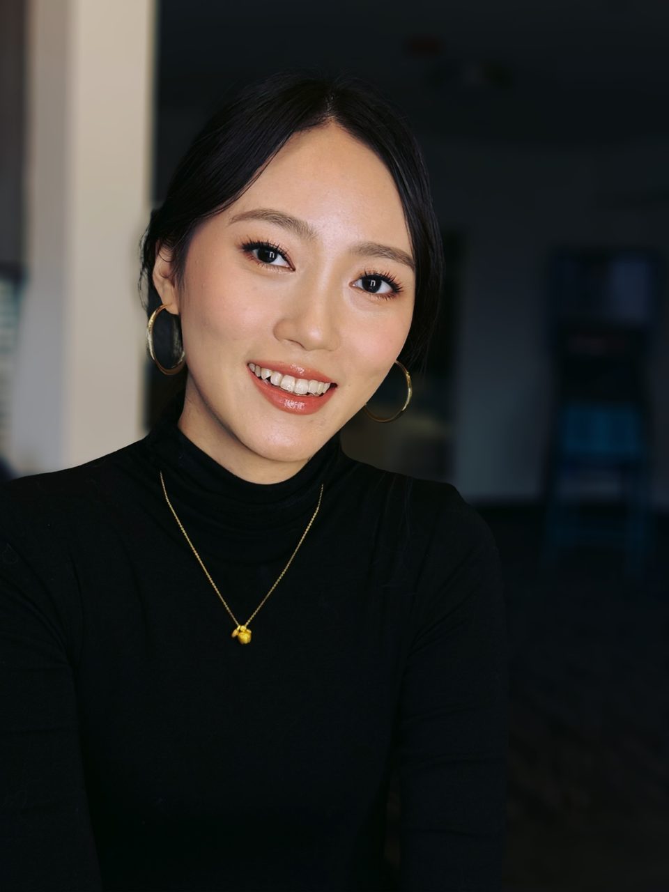 Smiling client with fresh, radiant everyday makeup