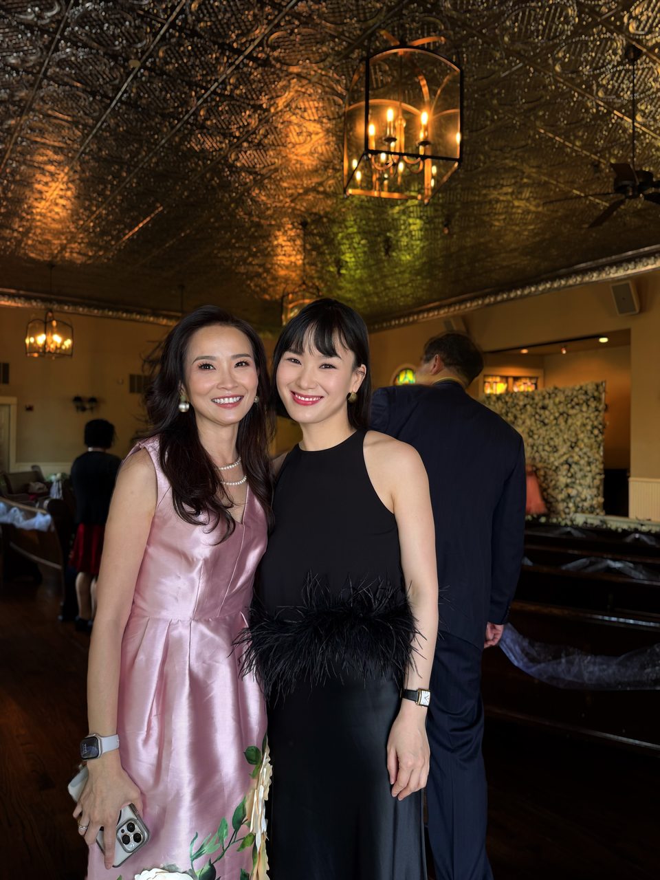 Two guests with evening makeup at a celebration