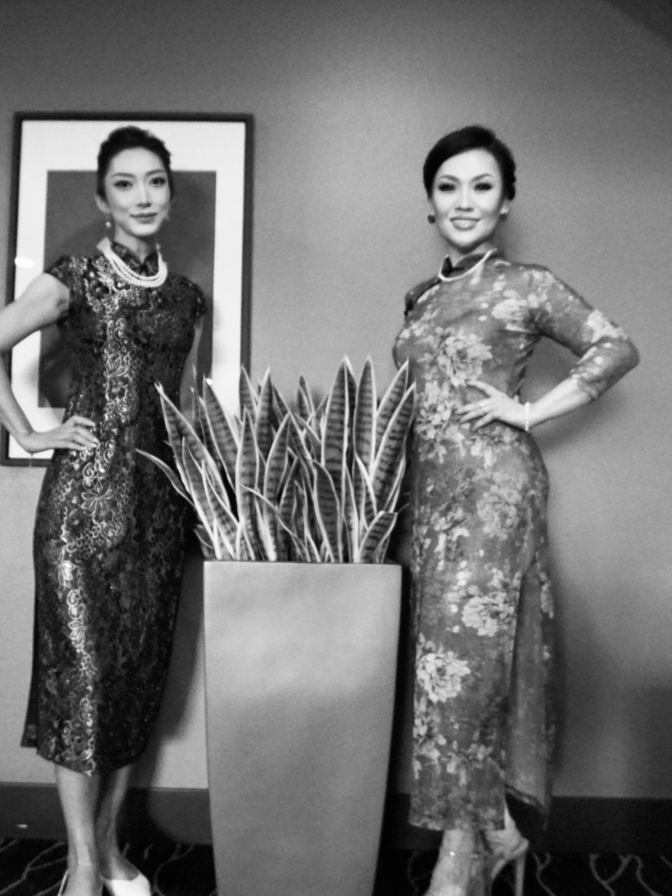 Black-and-white portrait of two women in vintage qipaos
