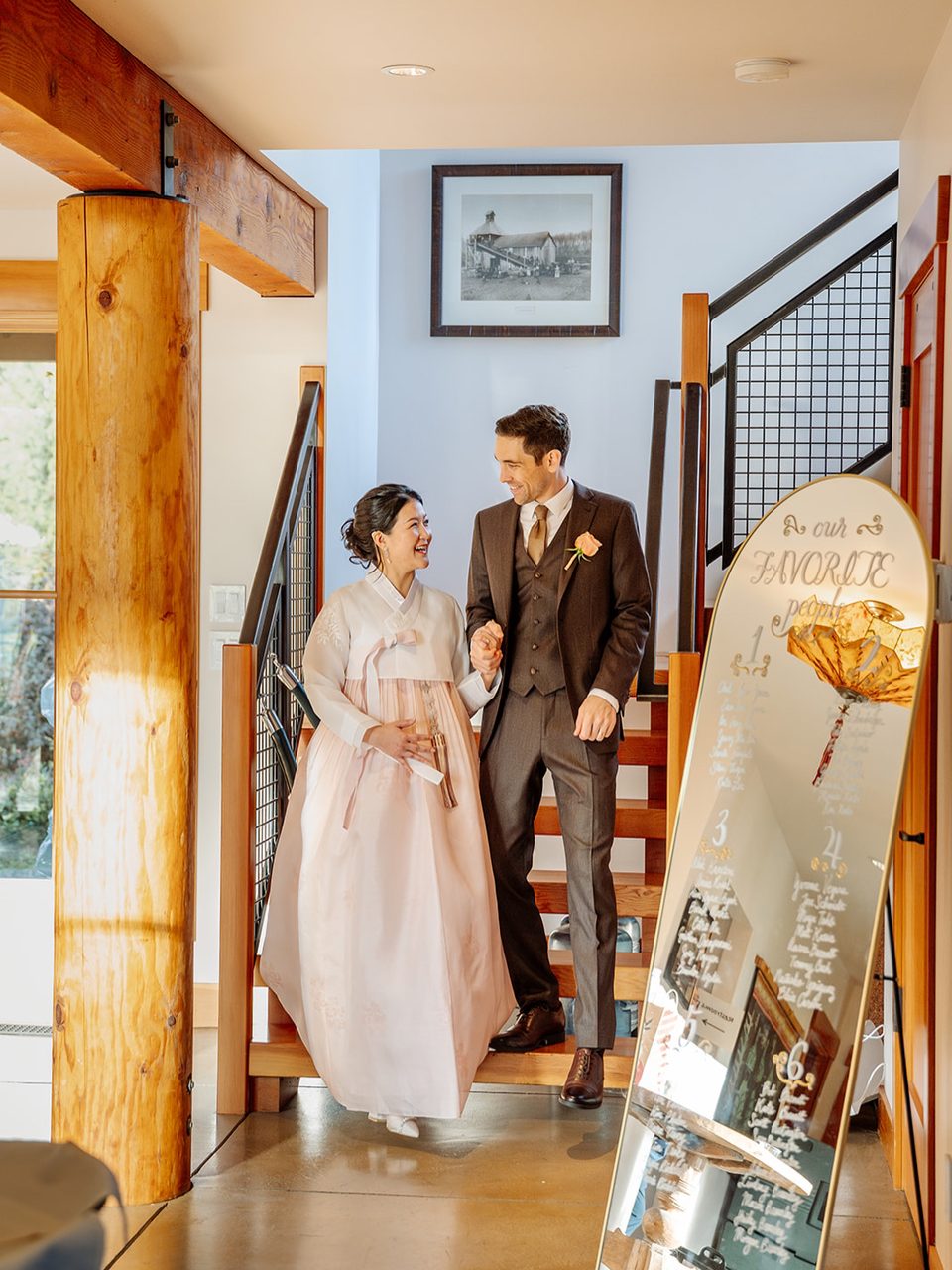 Bride in a hanbok with the groom on the stairs